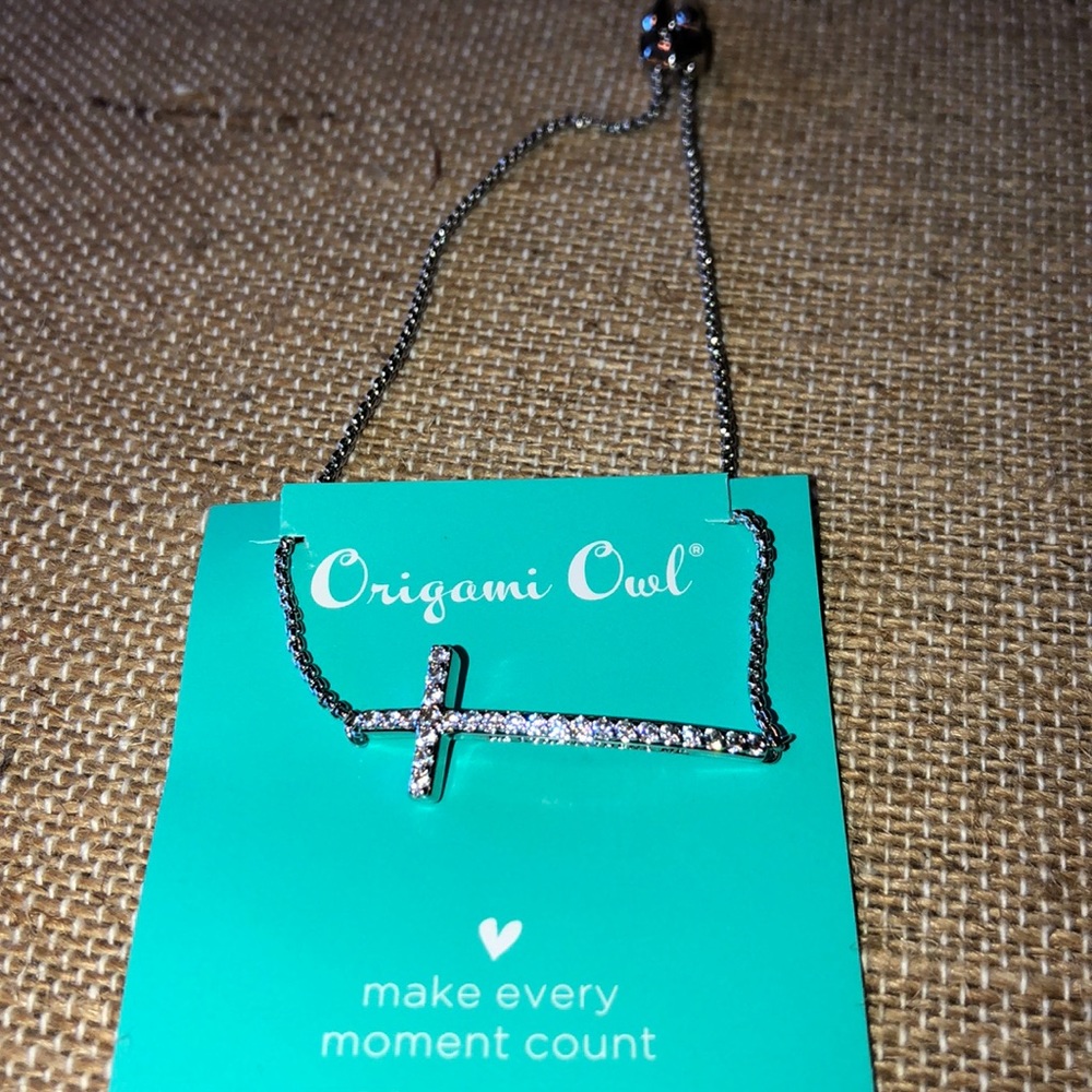 Silver bolo cross bracelet